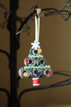 a christmas tree made out of cans and buttons