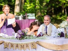 the bride and groom are sharing a toast at their wedding reception