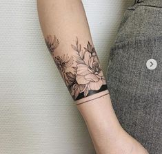 a person with a flower tattoo on their arm