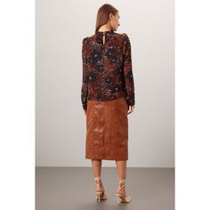 Brown floral chiffon (100% Recycled Polyester). Top. Long sleeves. Mock neck. Pull on. Imported. Brown Blouse With Blouson Sleeves For Fall, Fall Workwear Blouse With Sheer Sleeves, Chic Floral Print Blouse For Fall, Fall Office Blouse With Sheer Sleeves, Office Blouse With Sheer Sleeves For Fall, Floral Print Blouse For Office In Fall, Fall Blouse With Sheer Lantern Sleeves, Chic Long Sleeve Puff Top With Floral Print, Feminine Long Sleeve Puff Top With Floral Print