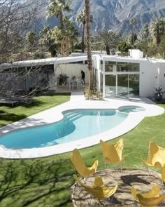 a house with a swimming pool in the yard