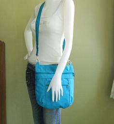 *** Please check 'shop announcement' for production time and delivery before your purchase. ***This bag is made from teal water-resistant nylon, a sturdy and durable material. It is big enough to hold lots of your essentials and a mini iPad. If you prefer this style in different colors, you can see color samples from my other  listings : http://www.etsy.com/shop/tippythai?section_id=5879767. Please leave your color request in "note to seller" box while ordering.A top zipper closure keep all of y Turquoise Crossbody Bag For Travel, Turquoise Crossbody Travel Bag, Blue Everyday Bag With Ykk Zipper, Turquoise Bags With Zipper Closure For Everyday Use, Turquoise Everyday Crossbody Bag, Travel Bag Women, Women Crossbody Bag, Hip Bag, Color Samples