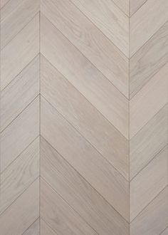 an image of wood flooring that looks like herringbones or chevron boards