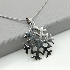 ▪︎ A sterling silver snowflake pendant. ▪︎ Size: 27 mm . Weighs: 3.6 gm. ▪︎ Can be used as a charm for necklaces, bracelets, anklets, key chains or as zip pullers. ▪︎ This pendant is handmade with hypoallergenic sterling silver. Most of my pieces are marked with a 925 silver stamp. ▪︎ Please note: This pendant comes WITHOUT the chain, however, you can add a snake chain in the required length while making your selection. You can also opt to choose other kinds of chains and bracelet chains from my Snowflake Pendant, Silver Snowflakes, Charm Necklace Silver, Snake Chain, Silver Charms, Silver Pendant, Anklets, Charm Necklace, 925 Silver