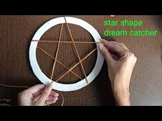 someone is making a star shaped dream catcher