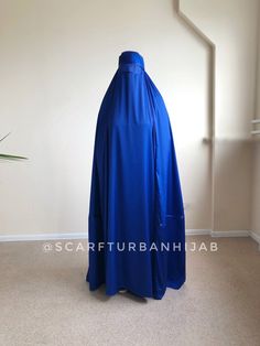 New creative design of traditional afghan burqa outfit amazing royal blue color ! This headpiece made like a skullcap at head with ties, widely and draped at the back. On sides it have a slots for arms, if you need you can use it or cover your arms inside. Especially for eyes we make a mesh insert! This item available in all colors if you need any changes please contact with me! Blue Modest Khimar For Eid, Traditional Blue Hijab For Eid, Modest Blue Niqab For Eid, Afghan Burqa, Long Hijab, Muslim Dress, Abaya Dress, For Eyes, Islamic Gifts