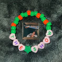 This product is a sturdy friendship bracelet made from pony beads. It would make a great gift for fans of Niall Horan. Friendship Beaded Bracelets With Letter Beads, Novelty Green Beaded Bracelets For Friendship, Rainbow Cake, Pony Beads, Gummy Bears, Niall Horan, Braided Bracelets, Friendship Bracelet, Fashion Bracelets