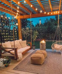 an outdoor living area with swings and lights