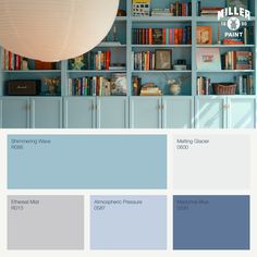 a room with blue bookshelves and shelves filled with various types of paint colors