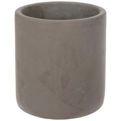 a gray vase sitting on top of a white table