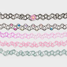 Enhance your kid's style effortlessly with the Girls' 5pk Flowers Tattoo Choker Necklace Set by art class™. It offers a delightful collection of 5 necklaces with flower motifs at an 11-inch length, these necklaces are perfect for young girls. The set features a pull-on closure for easy wear ensuring a comfortable and adjustable fit for your little one. Accessorize your girl’s ensemble with this flower tattoo necklace set from art class. art class™: One-of-a-kind looks for the one and only you. Cute Adjustable Cheap Choker, Cheap Multicolor Choker Necklace, Adjustable Trendy Purple Choker, Pink Flower Choker Necklace, Tattoo Necklace, Tattoo Choker Necklace, Girls Choker, Necklace Tattoo, Tattoo Choker