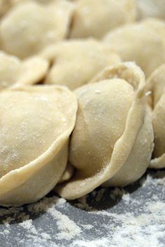 some dumplings that are sitting on a counter top and ready to be cooked in the oven