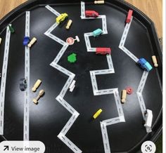 this is an image of a table with cars on it and the number seven in front