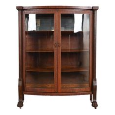 a wooden display case with glass doors on the top and bottom shelves, in an antique style