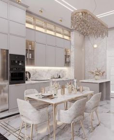 a dining room and kitchen area with marble flooring, white walls and ceiling lighting