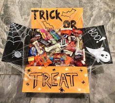 a trick or treat box filled with candy