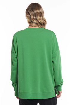 Loved your poppy sweat last season? Then cue the cheerleading squad… we've updated the Poppy sweat with her sister Jetta in West Village Green. Cut in the same uber comfy fit but now upgraded with our luxe sustainable Better Terry, a blend of cotton and recycled polyester. Inspired by old school varsity sweats, this slightly oversized jumper has a relaxed fit with side seam zips so you can show off a touch of colour layers. Fabric: Main: 60% Cotton / 40% Recycled Polyester Care Instructions : WARM GENTLE HAND WASH DO NOT DRY CLEAN (X) ﻿Measurements : Size in CM \ Size 8 10 12 14 16 18 Bust Width 117 122 127 132 137 142 Waist Width 117 122 127 132 137 142 Hem Width 117 122 127 132 137 142 Neckline to Hem 63 64 65 66 67 68 Green Sweaters, Long Sleeve Summer Dress, Cheerleading Squad, Maxi Dress Winter, Village Green, Linen Loungewear, Oversized Jumper, Sleeveless Dress Summer, West Village