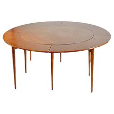 an oval wooden table with four legs