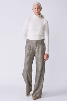 For a more elegant look this Fall, our Gabby Trouser fills that need. With a wider leg opening, this pleat pant has all the attitude you need. Great for day to play, this pant makes a great wardrobe staple. Hollywood waist construction, center front zip entry, single front pleats, belt loops, slant side pockets, back flap pockets, clean finish hem. - 100% Virgin Wool- Fabric woven in Italy- Made in NYC- Professional dry clean only- Our model is 5'11" wearing size S- Waist 32", Rise 9 1/2", Insea Plaid Wool Pants Women, Luxury Tailored Plaid Pants, Luxury Plaid Straight Bottoms, Plaid Cotton Wide-leg Pants, Plaid Wide-leg Pants With Pockets, Plaid Trousers, Pleated Pants, Wool Fabric, White Sweatshirt