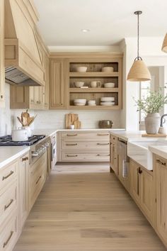 a kitchen filled with lots of wooden cabinets and counter top space next to a stove top oven