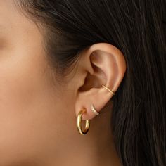 Classic Rope Gold Ear Cuff that will hug your conch perfectly. Perfect to wear alone or paired with other huggie earrings. Sold as a single earring. Gold Vermeil Hypoallergenic, lead and nickel free Thickness 1.5mm Inner Diameter 0.4in(10mm) Outer Diameter 0.5in(13mm) #E517-Gx1 Tarnish Resistant Huggie Ear Cuff, Nickel Free Huggie Ear Cuff For Everyday, Classic Huggie Ear Cuff As A Gift, Classic Huggie Ear Cuff Gift, Everyday Nickel-free Huggie Ear Cuff, Hypoallergenic Huggie Wrap Earrings, Hypoallergenic Yellow Gold Huggie Ear Cuff, Minimalist Hypoallergenic Huggie Ear Cuff, Adjustable Huggie Ear Cuff For Everyday