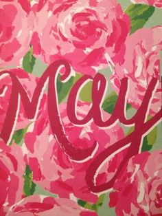 pink roses with the word mey painted on them in red and green, as well as some type of lettering