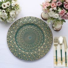 a place setting with flowers and silverware