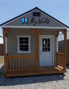 a small building with a porch and door