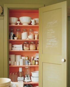 an open pantry door with spices and condiments on the shelves next to it