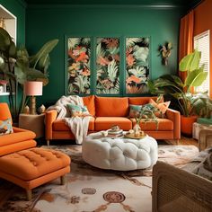 a living room with green walls and orange furniture