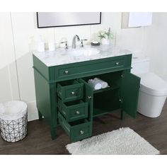 a bathroom vanity with two drawers and a white rug on the floor next to it