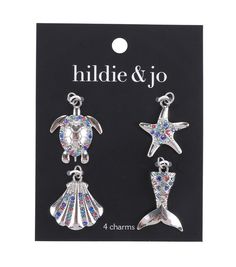 two silver tone sea turtle and starfish earrings with crystal stones on each earring