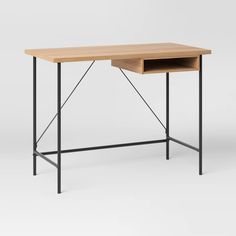 a wooden desk with metal legs and a drawer on the top, against a white background