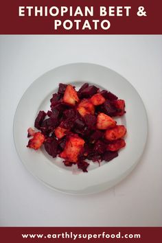 a white plate topped with beets and carrots next to the words ethiopian beef & potato