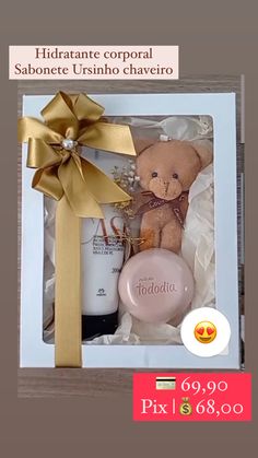 a teddy bear in a gift box with a bottle of shampoo and a gold bow