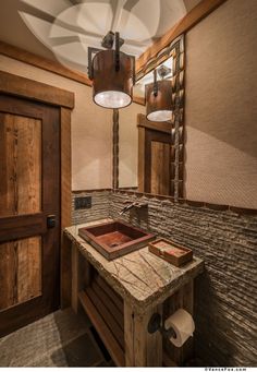 a bathroom with a wooden sink and mirror