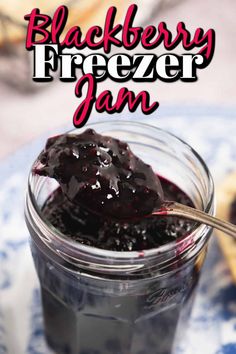 blackberry freezer jam in a glass jar with a spoon on the side and text overlay reading blackberry freezer jam