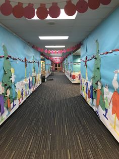 the hallway is decorated with colorful paper decorations