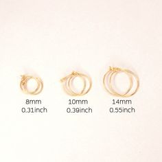 This listing is for a PAIR of Earrings. Hoop measures - 8, 10 or 14 mm diameter. Available in yellow gold color. These earrings are tiny wire hoops, very lightweight and thin. They are the perfect unisex earring easy to use. Simple and dainty lovely for everyday. Gift for mom, sister, girlfriend, best friend. The hoops made of sterling silver 925. Yellow gold plating on silver is 1 micron - very reliable plating. * The HOOP measures 8, 10, 14mm inner diameter * The HOOPs made of standard sliver Second Hole Earrings, Minimalist Ear Cuff, Hoop Earring Set, Earring Pins, Unisex Earrings, Simple Hoop Earrings, Climber Earrings, Hoop Earring Sets, Earrings Hoop