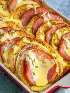 a casserole dish with ham and cheese on top, ready to be eaten