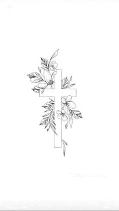 a cross with flowers and leaves on it