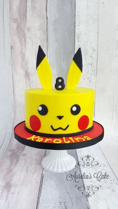 a pokemon cake with pikachu ears on top