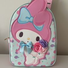 Brand New Her Universe My Melody Pastel Floral Mini Backpack Features My Melody As A Central Appliqu With Her Ear Sticking Over The Top, Holding A Bouquet Of Fabric Roses And A 3d Satin Bow On Her Neck. Roses Are All Over The Background And There's Lace Trim On The Side Pockets. Comes With Interior Zipper Pocket. 8" X 4" X 11" Polyurethane Interior Zipper Pocket Side Pockets **Please Note: Faded Mark On Melody’s Right Side. See Photo. Pink Kawaii Backpack Gift, Pink Hello Kitty Backpack For Daily Use, Pink Kawaii Hello Kitty Backpack, Kawaii Pink Hello Kitty Backpack, Kawaii Hello Kitty Bag For Back To School, Cute Hello Kitty Rectangular Backpack, Pink Hello Kitty Print Bag For Back To School, Pink Hello Kitty Print Standard Backpack, Cute Hello Kitty Backpack For Daily Use