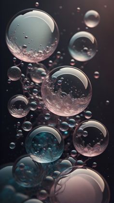 soap bubbles floating in the air on a black background with some water droplets around them