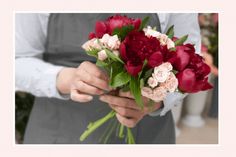 a person holding a bouquet of flowers in their hands with the caption, there is no image here to provide a caption for