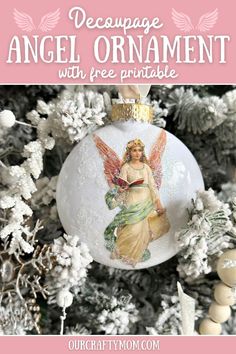 an angel ornament hanging from a christmas tree with text overlay that reads, decoupage angel ornament with free printable