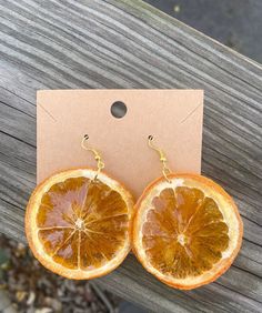 A unique pair of earrings for anyone who wants to add a little nature to their style. Made with real oranges, dried and protected with resin.  * Please note each pair varies in size and details * Orange Slice Jewelry, Orange Fruit Design Earrings As Gift, Handmade Apricot Earrings For Gift, Handmade Apricot Earrings Perfect For Gifts, Orange Resin Earrings, Diy Resin Earrings, Pretty Accessories, Fruit Earrings, Polymer Clay Jewelry Diy