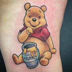 a tattoo with a bear holding a bucket and the word chummy on it