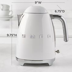 an electric kettle is shown with measurements