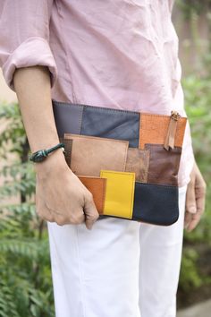 Add this genuine vintage leather patchwork clutch to your collection from Melbourne Leather Co. Key features: Nubuck Leather, Natural Cow Leather, Vegetable Tan Leather Designed and made in Australia and only produced in limited quantity. Handmade patchwork. Size: L - 28cm, H - 20cm, D - 4cm. With its Spacious single compartment, there is plenty of room for storing your essentials such as your phone, keys, and more. Comes with  Worldwide!We have warehouses both in Australia and India and despatch orders worldwide from both our warehouses. Despite every effort to provide accurate images of each product's colour and design, actual colours and design may vary slightly, due to different device screen settings, the lighting in the installation location, slight differences in product finishes ov Patchwork Clutch, Hobo Bag Patterns, Leather Working Patterns, Magic Bag, Leather Accessories Handmade, Leather Bag Pattern, Tool Pouch, Leather Patchwork, Leather Travel Bag